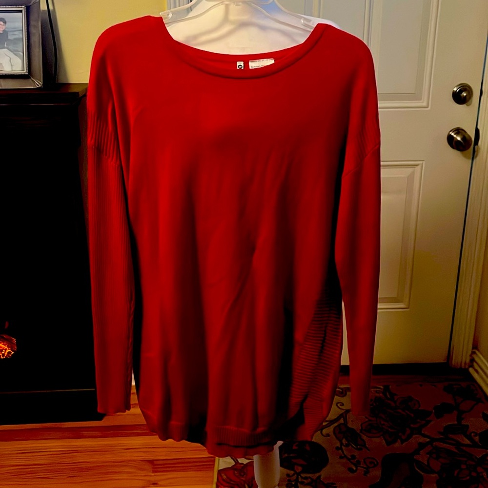 Red pullover long sleeve  sweater with button accents on shoulders